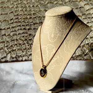 Gold tone pendant necklace